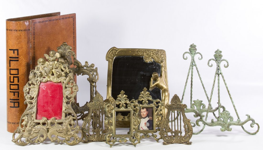 Brass Frame Assortment: Brass Frame Assortment Including a mirror; together with four verdigris metal table-top easels, two brass picture frames, two brass objects and a metal storage box that looks like a book Height: 15.75