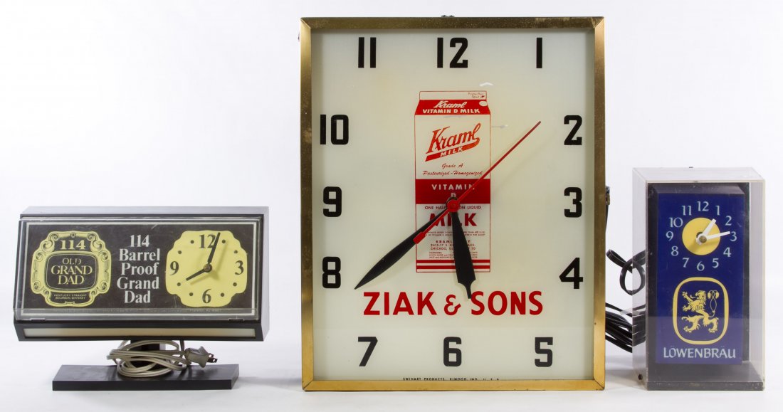 Electric Wall Clock Advertising Assortment: Electric Wall Clock Advertising Assortment Three items including Old Grand Dad whiskey, Lowenbrau beer and Kraml milk Height: 16.00 inches, Width: 13.00 inches Category: Decorative Arts > Clocks Shipp