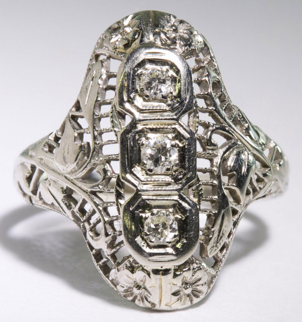 18k White Gold and Diamond Ring: 18k White Gold and Diamond Ring Art Deco setting having three round cut diamonds set vertically Size: 5 Weight: 1.81 dwts. (total weight) Category: Jewelry & Timepieces > 18k Gold Shipping Status: Leo