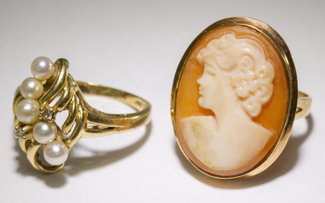 14k Gold Rings: 14k Gold Rings Two rings, one having an oval carved shell cameo of a female and the other having five faux pearls accented by two round cut diamond chips Size: 5 Weight: 3.97 dwts. (total weight) Cate