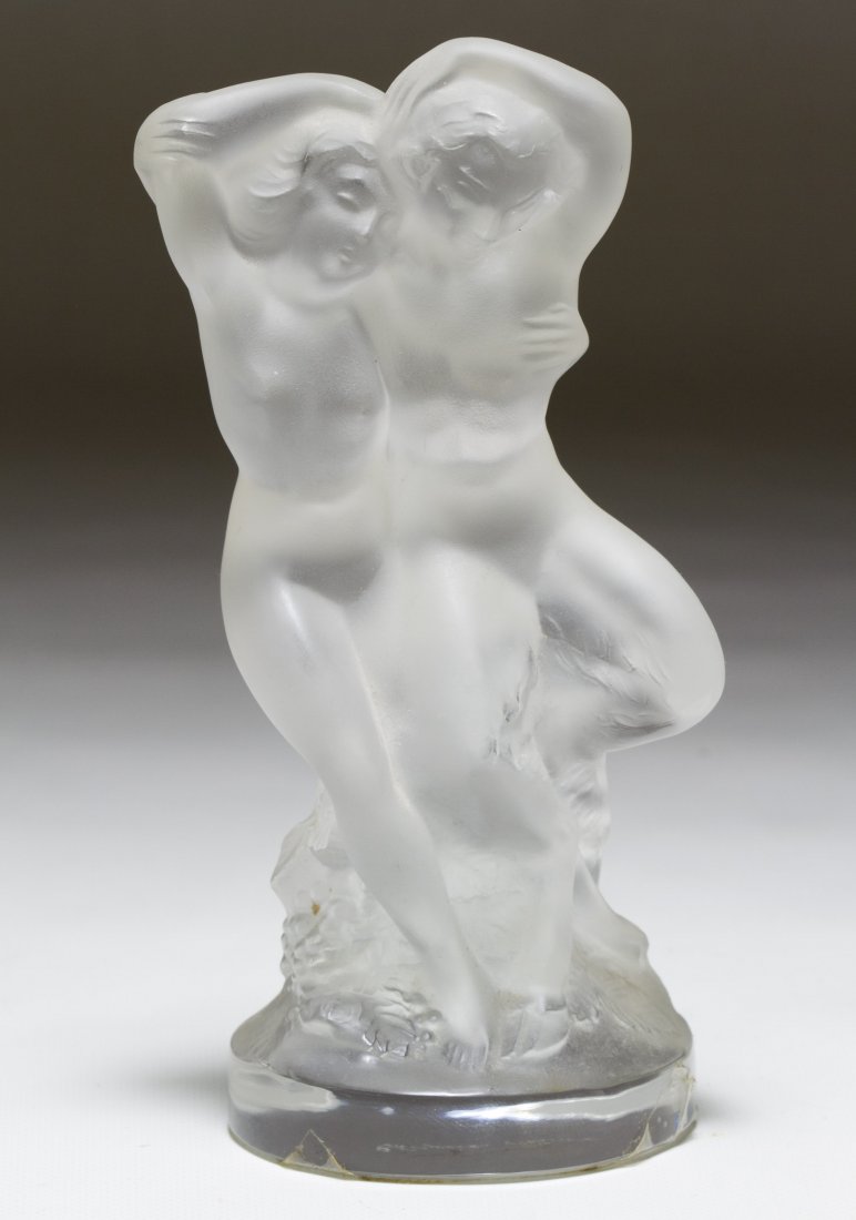 Lalique Crystal 'Double Nude Faune' Couple: Lalique Crystal 'Double Nude Faune' Couple France, etched signature to the underside; together with an Lalique style coaster Height: 5.50 inches (tallest) Category: Crystal > Lalique Shipping Status: