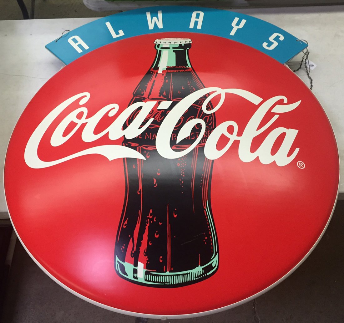 Coca-Cola Advertising Sign: Coca-Cola Advertising Sign Having a two sided, printed plastic bubble shaped body and wire hooks at top for hanging on a wall; reportedly a one-of-a-kind prototype sign Height: 42.00 inches, Width: 38