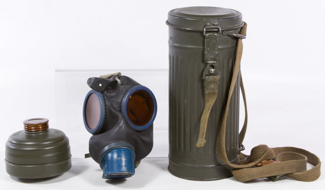 World War II German Gas Mask: World War II German Gas Mask Un-issued, unused, spare lenses in lid Height: 10.75 inches (storage can) Category: Military & Weapons > World War II Shipping Status: Leonard Auction, Inc. will directly 