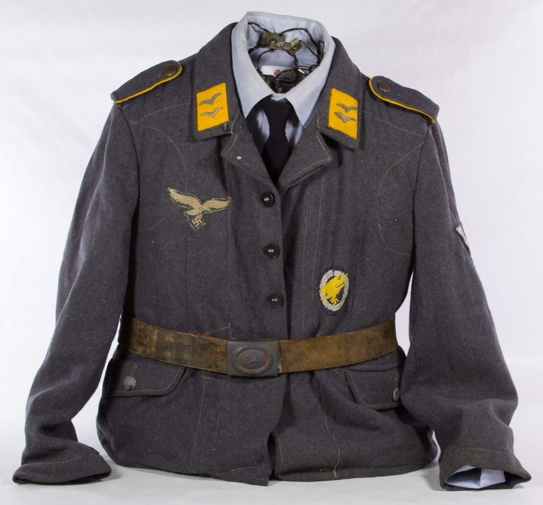 World War II German Nazi Paratrooper Tunic: World War II German Nazi Paratrooper Tunic Including belt, buckle and patches; displayed on a wire manikin Height: 21.00 inches, Width: 19.00 inches Category: Military & Weapons > World War II Shippin