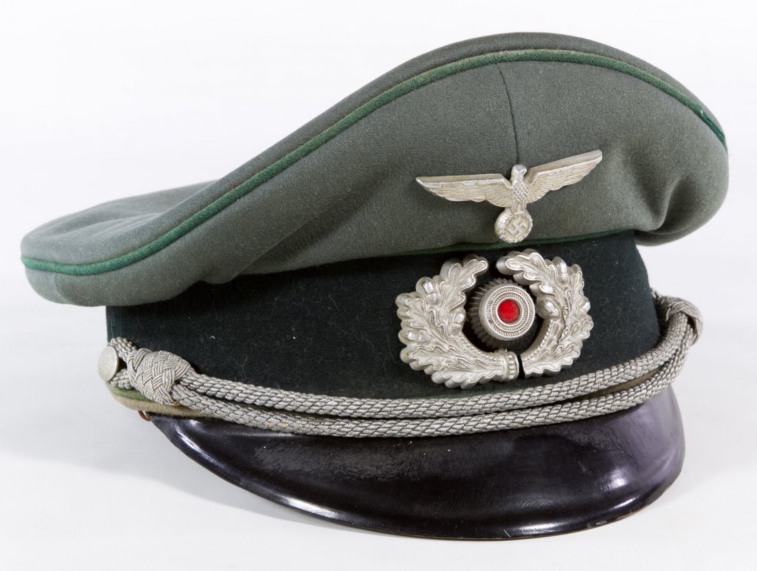 World War II German Officer Visor Cap: World War II German Officer Visor Cap Having oak cluster emblem Length: 10.50 inches, Width: 9.50 inches Category: Military & Weapons > World War II Shipping Status: Leonard Auction, Inc. will directl