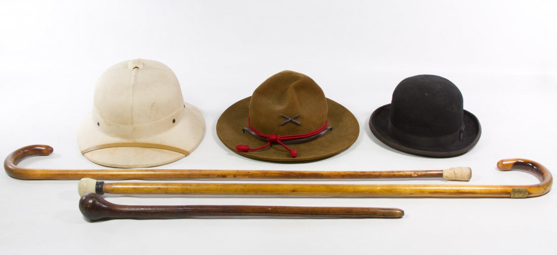 Hat and Cane Assortment: Hat and Cane Assortment Three hats including a Dunlap 'Charlie Chaplin', 'Smokey the Bear' ranger hat and 'Pith Helmet' and three canes / walking stick including one from the Century of Progress Lengt