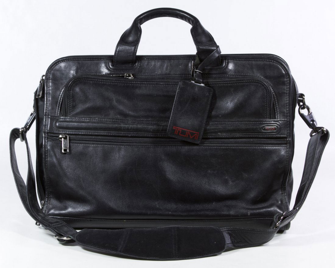 Tumi Black Leather Carry-on Bag: Tumi Black Leather Carry-on Bag Having two handles and a shoulder strap Width: 19.00 inches Category: Clothing & Accessories > Purses and Handbags Shipping Status: Leonard Auction, Inc. will directly