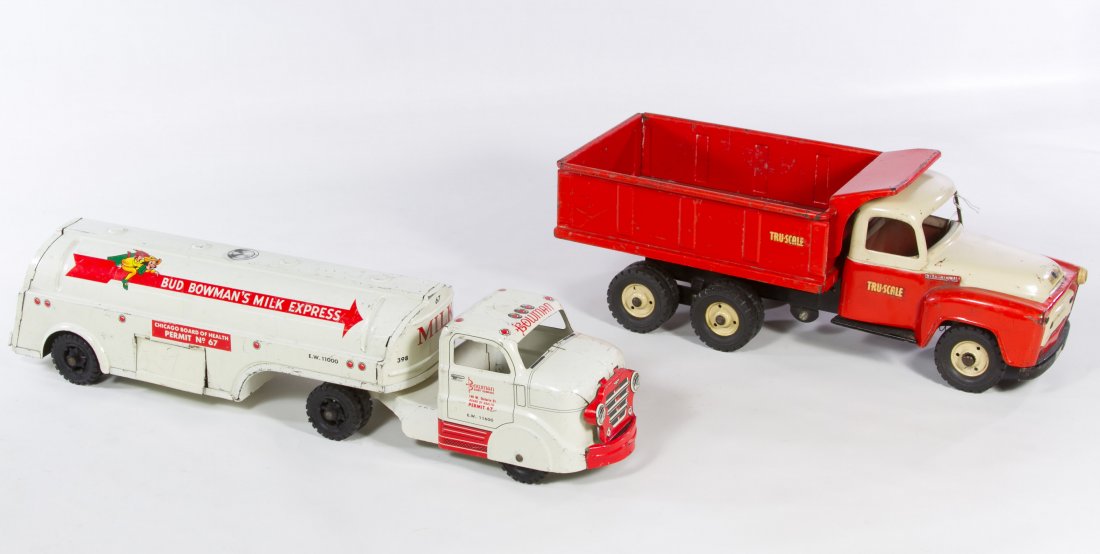 Marx Bud Bowman's Milk Express Tin Truck: Marx Bud Bowman's Milk Express Tin Truck c.1950, numbered 398, stamped mark to the underside; together with a Tru-Scale dump truck Length: 18.00 inches (longest) Category: Toys and Dolls > Vintage Toy
