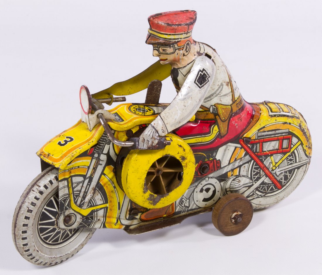 Marx Tin Wind-Up Motorcycle: Marx Tin Wind-Up Motorcycle Yellow tin lithographed chassis and driver Length: 8.50 inches Category: Toys and Dolls > Vintage Toys Shipping Status: Leonard Auction, Inc. will directly ship via USPS Ap