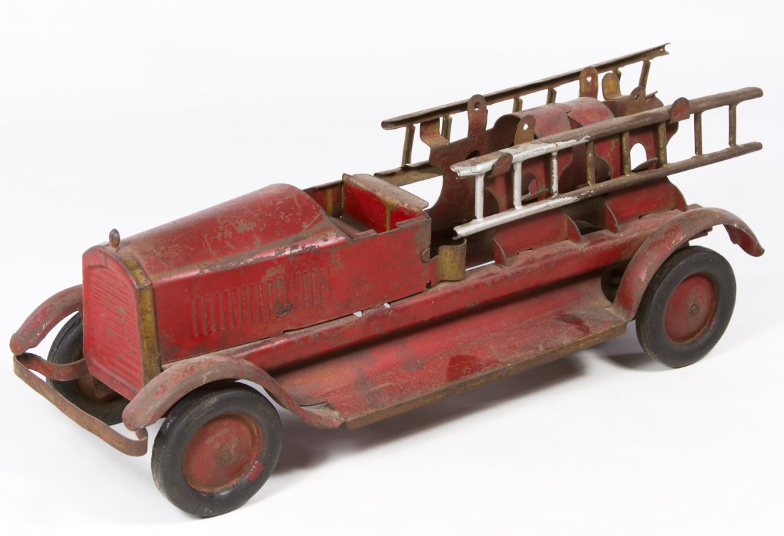 Turner Pressed Steel Fire Ladder Truck: Turner Pressed Steel Fire Ladder Truck c.1940, having a red body with two ladders and four rubber wheels Length: 16.50 inches Category: Toys and Dolls > Vintage Toys Shipping Status: Due to size, weig