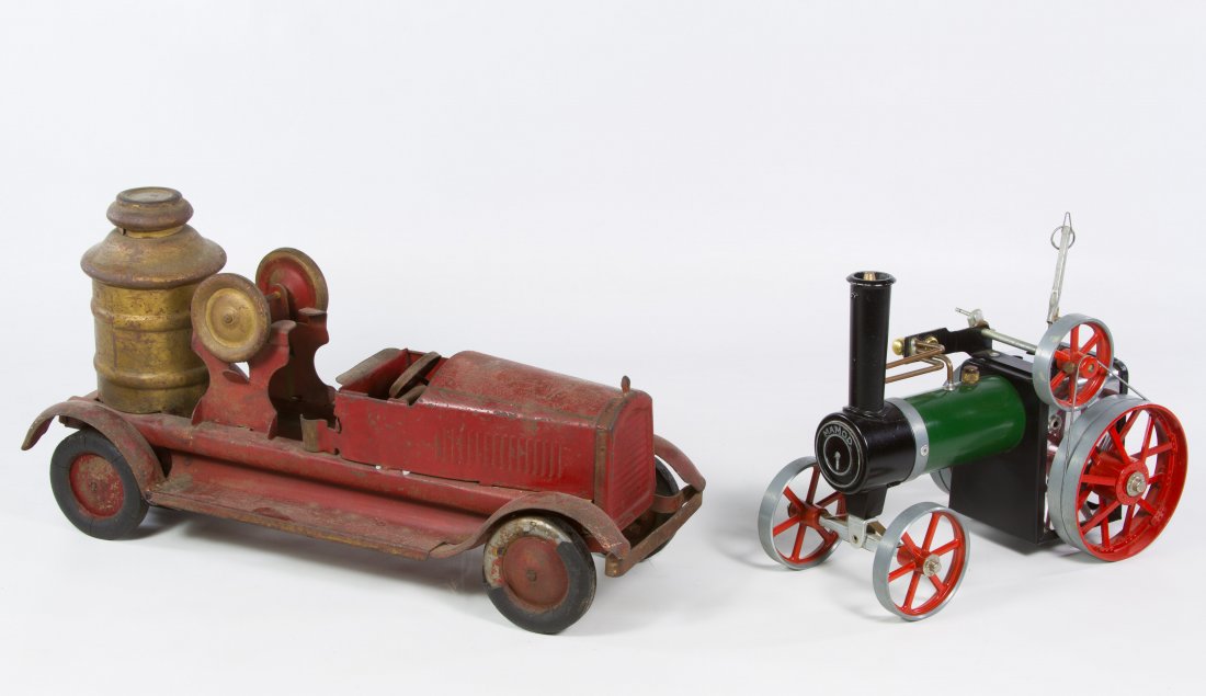 Turner Toys Fire Engine Pump Truck: Turner Toys Fire Engine Pump Truck c.1940, having a pressed steel body and rubber tires; together with an English Mamod steam engine tractor Length: 15.00 inches (pump truck) Category: Toys and Dolls 