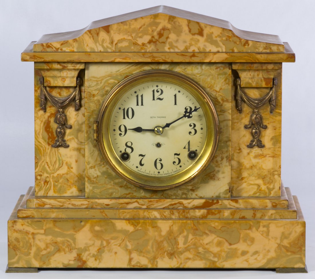 Seth Thomas Mantel Clock: Seth Thomas Mantel Clock Having a marble style veneer and marked '296-C-M P 69059' on label inside back door; including key and pendulum Height: 12.00 inches, Width: 14.00 inches, Depth: 6.50 inches C