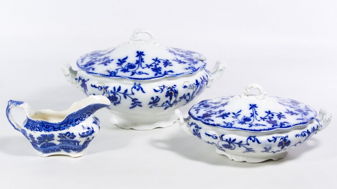 Flow Blue China Assortment: Flow Blue China Assortment Two covered casseroles; together with a transferware gravy boat; together with a fish knife and fork set, mother of pearl and sterling silver ferrel serving pieces and silve
