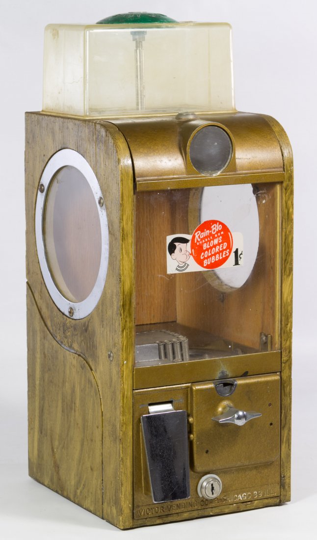 One-cent Gumball Machine by Victor Vending Co.: One-cent Gumball Machine by Victor Vending Co. c.1950, having wood sides and plastic top Height: 18.50 inches, Width: 7.50 inches, Depth: 8.50 inches Category: Collectibles > Food Shipping Status: Due