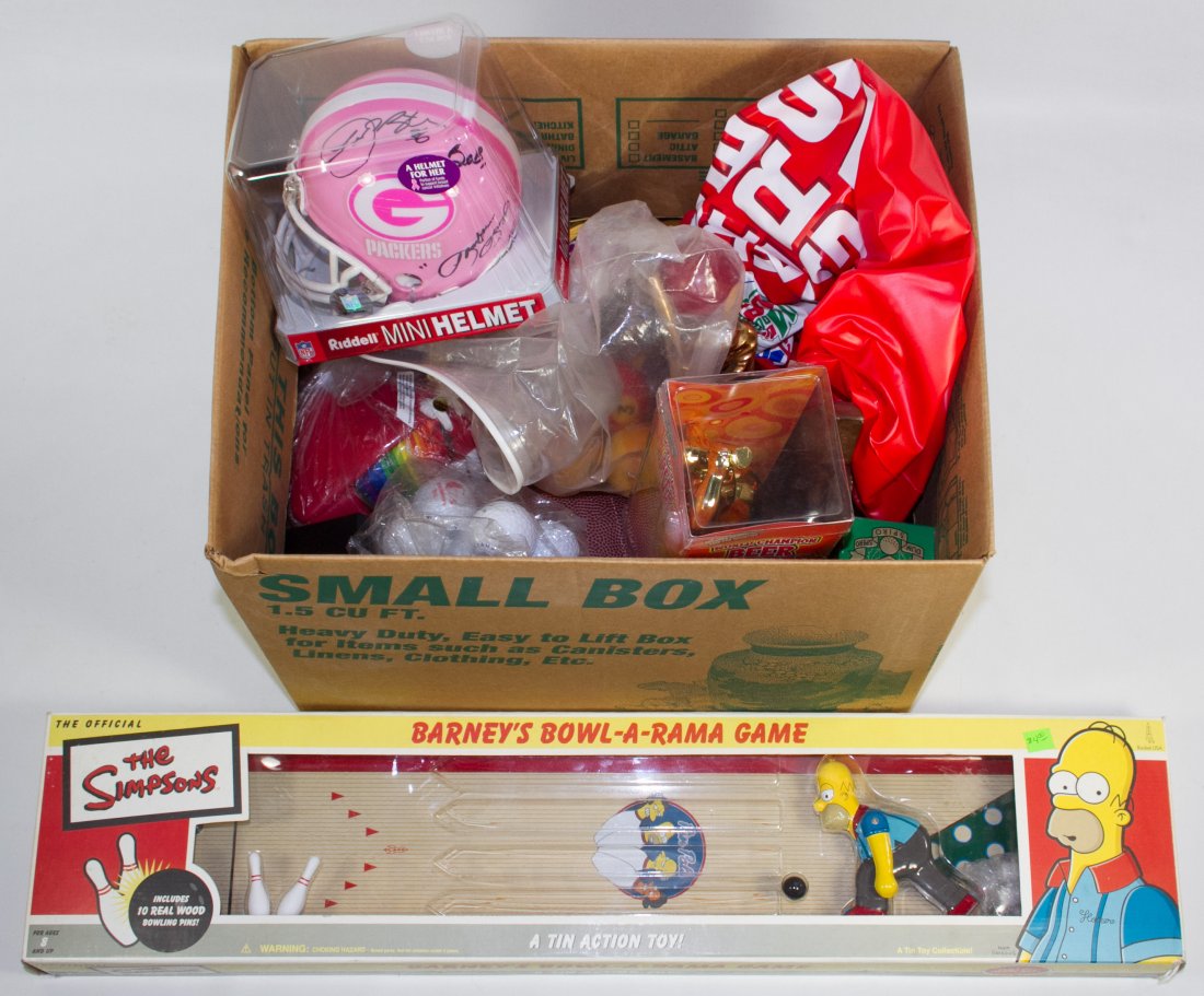 Sports Theme Toy Collectible Assortment: Sports Theme Toy Collectible Assortment Including a Simpsons Bowl-A-Rama game in box, trophies, footballs, golf balls and inflatables Category: Collectibles > Sports Shipping Status: Due to size, weig