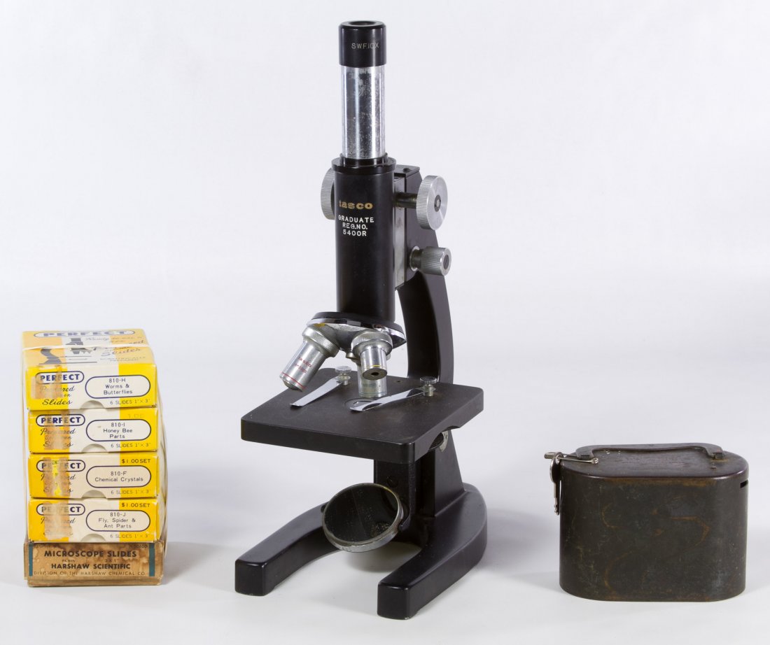 Microscope, Slides and Coin Holder Assortment: Microscope, Slides and Coin Holder Assortment Including a Tasco 5400R microscope, specimen slides, a metal still bank and a box of plastic coin holders Height: 14.50 inches Category: Cameras & Electro