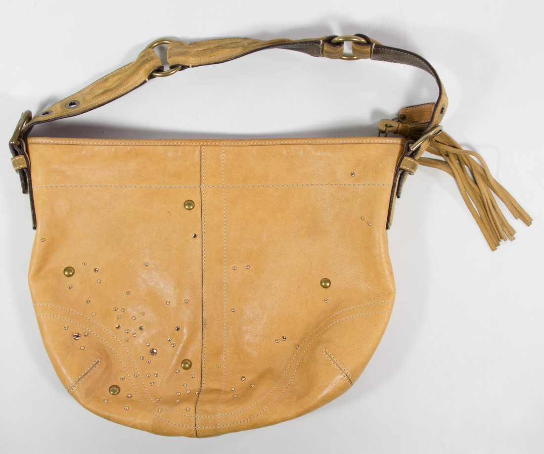 Coach Purse: Coach Purse Having serial #D05S-8A28, light tan leather with brass and crystal studs and a short strap Height: 11.00 inches, Width: 14.00 inches Category: Clothing & Accessories > Purses and Handbags