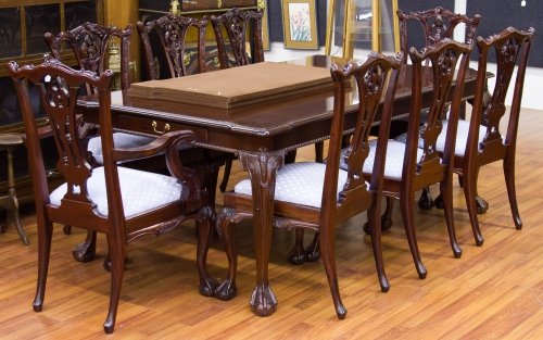 Chippendale Style Mahogany Dining Room Table and Chairs: Chippendale Style Mahogany Dining Room Table and Chairs by Stoneleigh Including a table with striped banding around edge, pull out drawers at each end, one leaf, two arm chairs and six side chairs wit