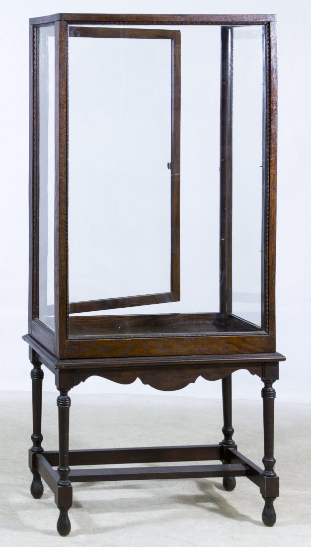 Oak Display Case on Stand: Oak Display Case on Stand Having wood framed glass top, back, sides and door Height: 59.00 inches, Width: 26.00 inches, Depth: 14.00 inches Category: Furniture > Other Shipping Status: Due to size, we