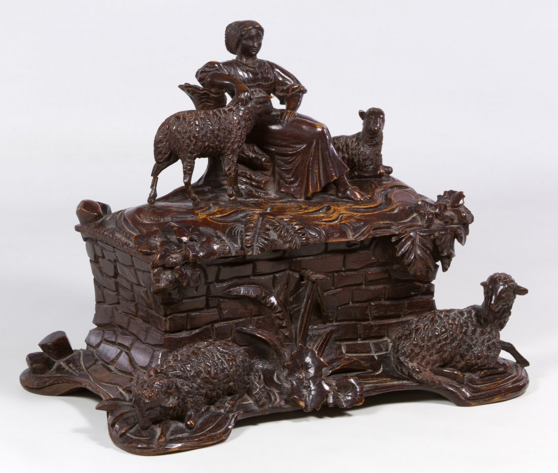 Black Forest Carved Wood Jewelry Box: Black Forest Carved Wood Jewelry Box Carved and stained box with shepherdess, sheep and ferns on exterior, blue lined interior and a key Height: 9.50 inches, Width: 13.00 inches, Depth: 6.00 inches Ca