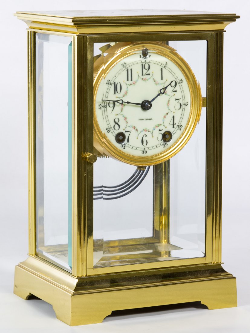 Seth Thomas Regulator Mantel Clock: Seth Thomas Regulator Mantel Clock Having an enamel face, four beveled glass panels, two keys, two pendulums and parts Height: 10.75 inches, Width: 6.75 inches, Depth: 5.25 inches (case) Category: Dec