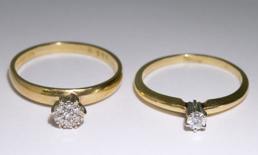 14k Gold and Diamond Rings: 14k Gold and Diamond Rings Two rings, one having a solitaire round cut diamond, the other having a central diamond surrounded by six round cut diamonds to appear as a larger gemstone Size: 5.25 & 6 We