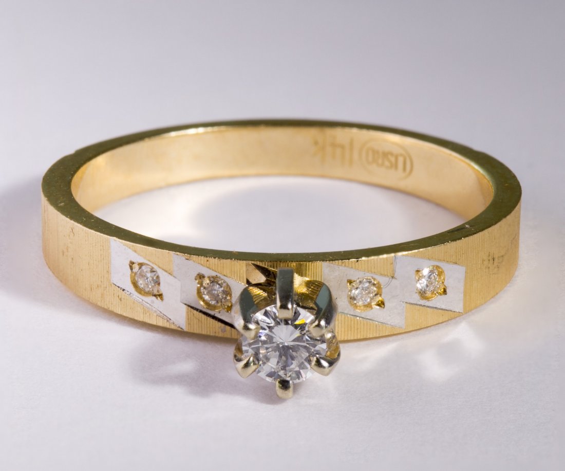 14k Gold and Diamond Ring: 14k Gold and Diamond Ring Having a solitaire set round cut diamond flanked by four diamond chips on the brushed band Size: 6.5 Weight: 1.72 dwts. Category: Jewelry & Timepieces > 14k Gold Tax Status: 