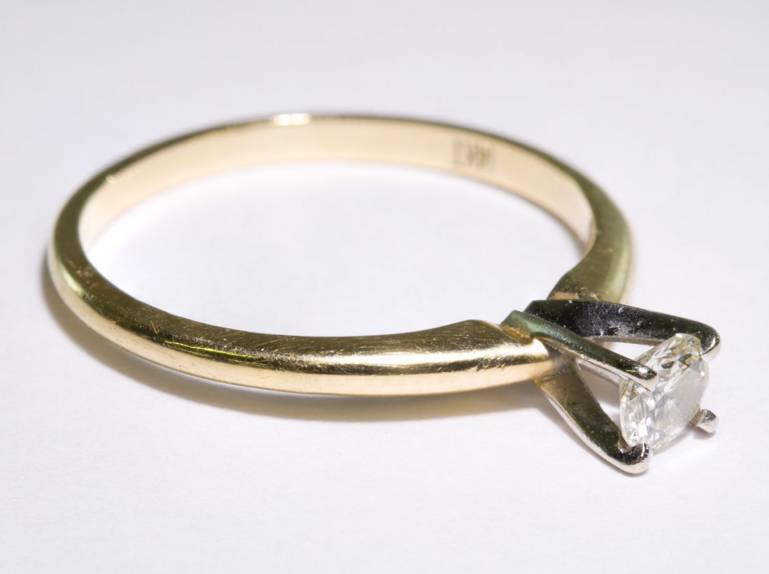 14k Gold and Diamond Ring: 14k Gold and Diamond Ring Having a round cut solitaire set diamond weighing approximately 0.25CT Size: 6.5 Weight: 1.21 dwts. (total weight) Category: Jewelry & Timepieces > 14k Gold Shipping Status: 