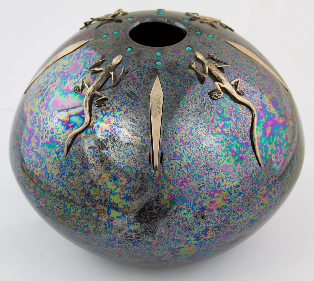 Lizard Vase by Randall Blaze: Lizard Vase by Randall Blaze Having an incised signature on the underside and an iridescent black glaze with applied metal lizards and turquoise stones Height: 7.00 inches, Width: 8.00 inches Category