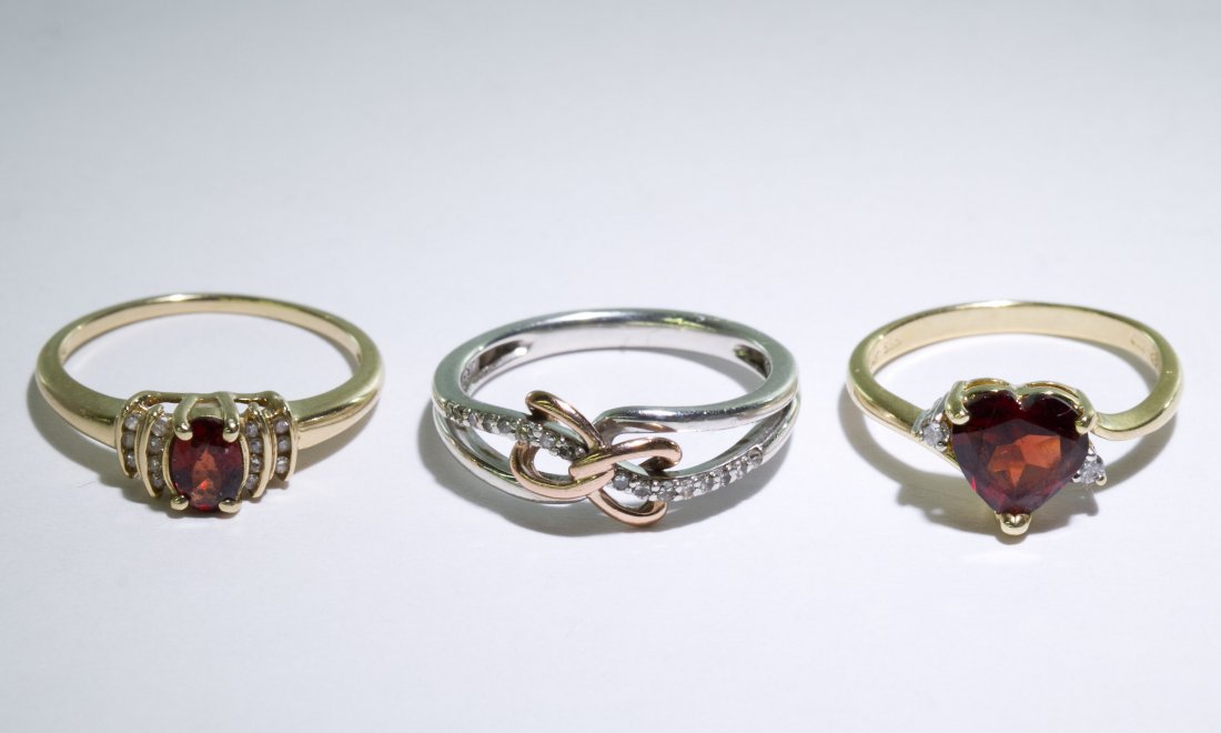 14k, 10k Gold and Sterling Silver Rings from Zales: 14k, 10k Gold and Sterling Silver Rings from Zales Three pieces including 14k gold having a heart-shaped garnet adorned by diamond chips, 10k gold having an oval cut garnet adorned by diamond chips an