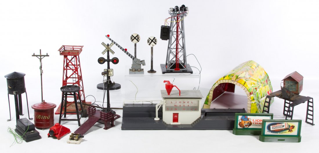 Toy Train Signal Tower, Tunnel and Accessory Assortment: Toy Train Signal Tower, Tunnel and Accessory Assortment Including a Marx tin lithographed tunnel, a Colber Corporation electric light tower, a Lionel #464 saw mill building and a Bing water tower base