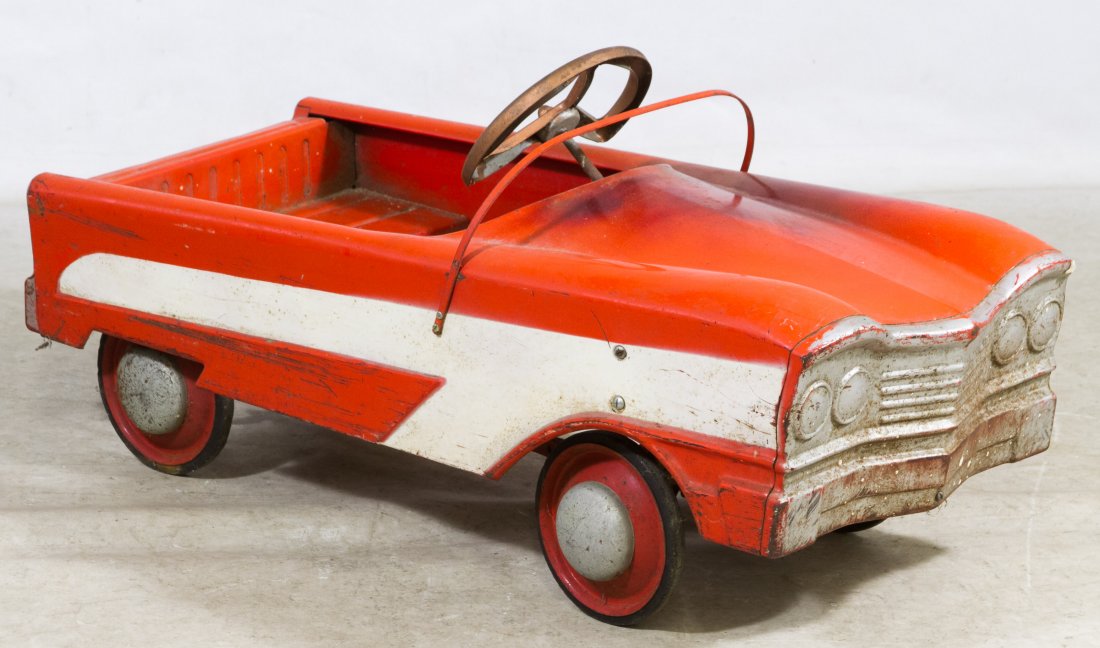 Red and Silver Pedal Car: Red and Silver Pedal Car c.1950, having a silver front fender, white stripes on the sides Height: 18.00 inches, Length: 37.00 inches, Width: 16.00 inches Category: Toys and Dolls > Vintage Toys Shippi