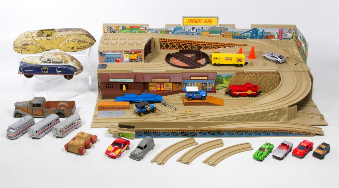 Toy Vehicle Assortment: Toy Vehicle Assortment Including a Metal Masters cast metal pick up truck, a State Police Siren tin lithographed car, a Midgetoy train set, Tootsietoy and Matchbox vehicles and a plastic N-scale foldi