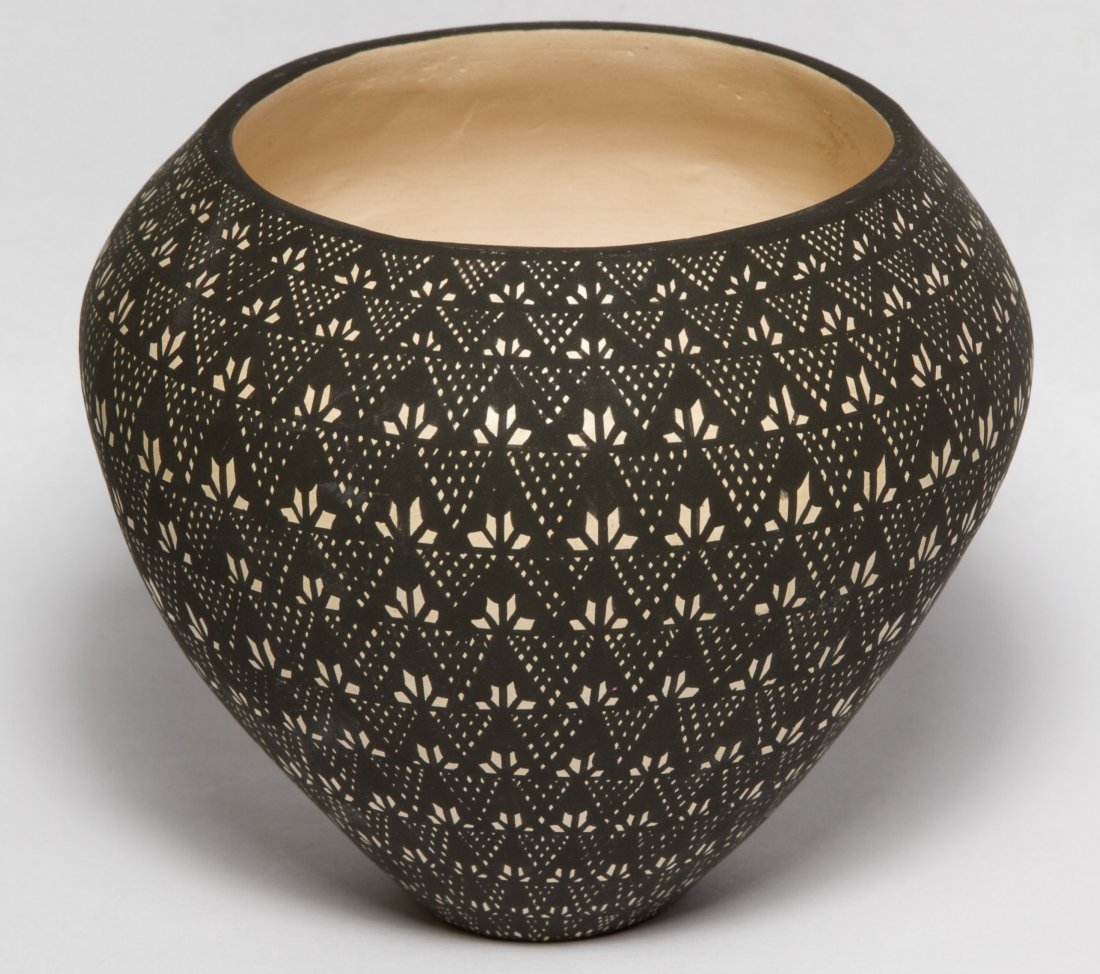 Acoma New Mexico Pottery Seed Jar by Sandra Victorino: Acoma New Mexico Pottery Seed Jar by Sandra Victorino Having a black and white geometric design with slight incised lines; signed with initials on the underside Height: 4.00 inches, Diameter: 4.50 inc