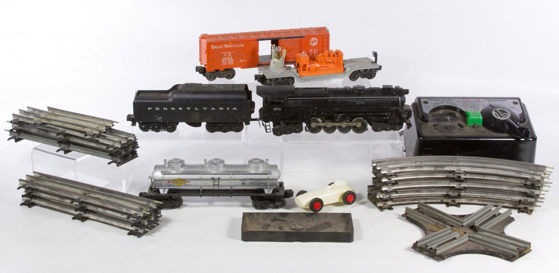 Lionel O-Gauge Model Toy Train Assortment: Lionel O-Gauge Model Toy Train Assortment Including engine #671, tender #2671W, cars #6464, #3520 and #6415; together with transformer Type TW, train track, Lionel box for set #2203WS and a white plas