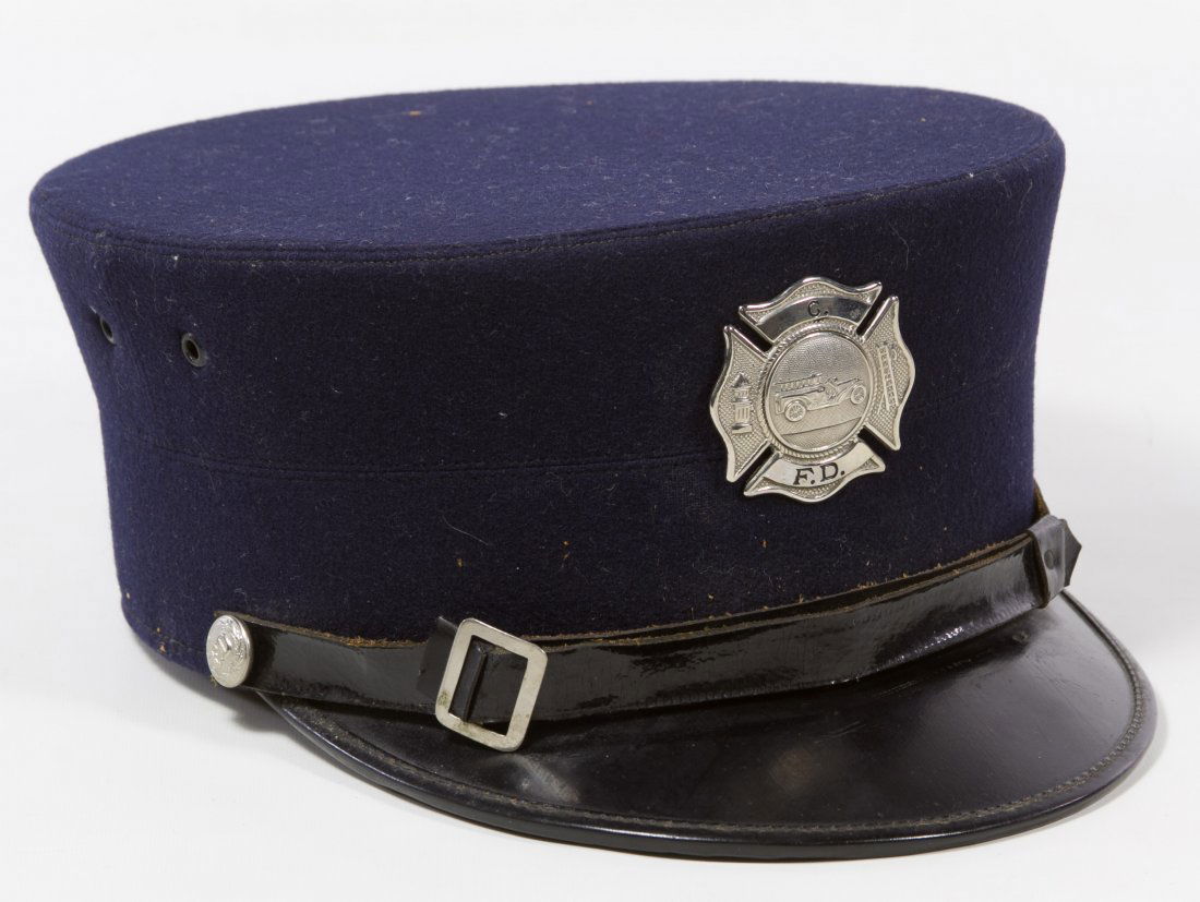 Chicago Fire Department Dress Hat: Chicago Fire Department Dress Hat c.1910, blue wool visor cap with a 'CFD' Maltese Cross style badge on crown, leather strap with FD marked button accents, a 'Goebel' woven label on the underside the