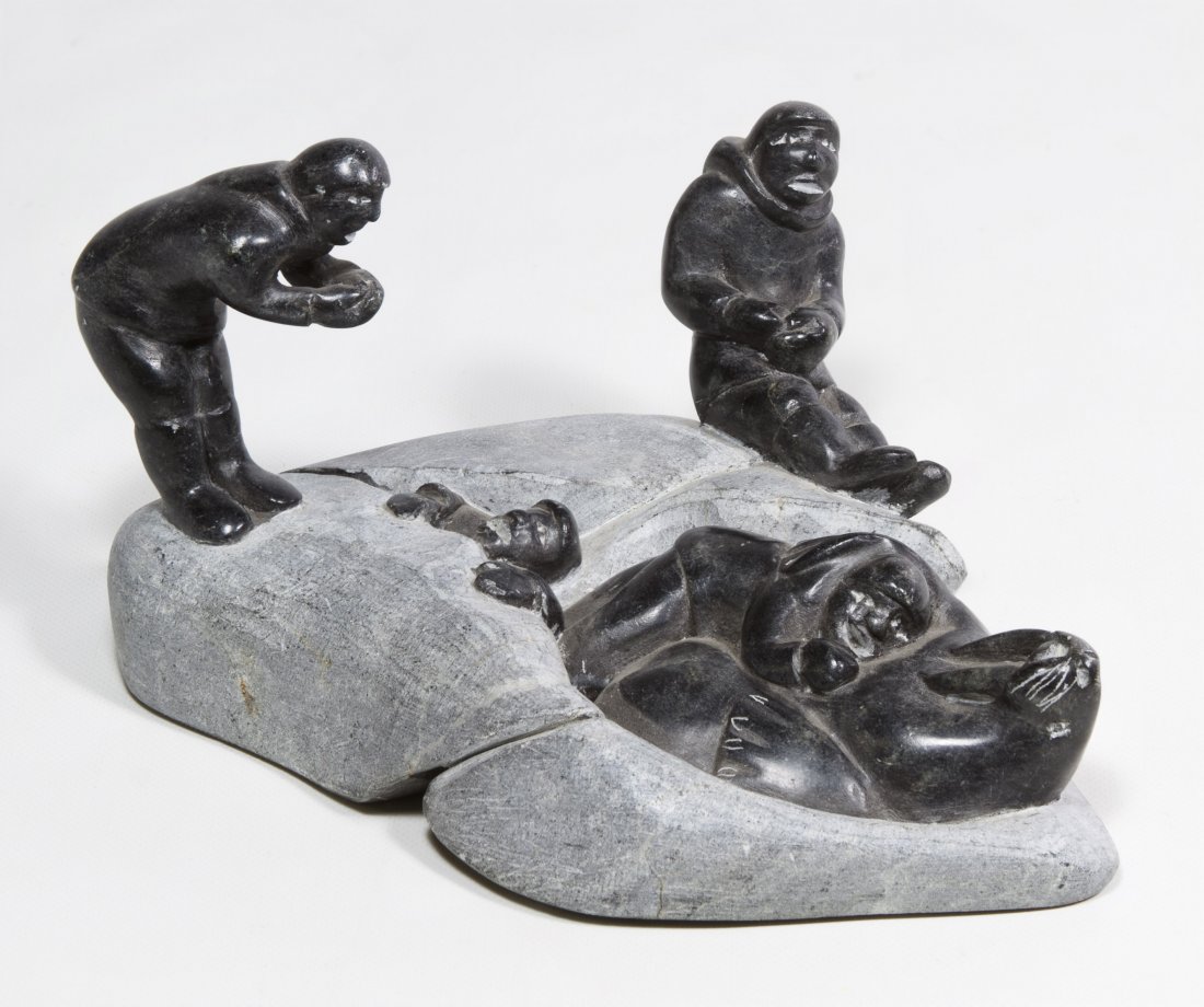 Carved Canadian Inuit Eskimo Soapstone Sculpture: Carved Canadian Inuit Eskimo Soapstone Sculpture c.1980, signed on underside, depicting four figures with a walrus Height: 4.00 inches, Width: 7.50 inches, Depth: 5.50 inches Category: Decorative Arts