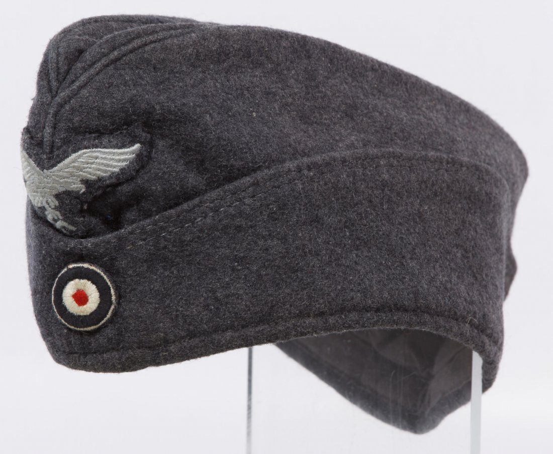 World War II German Luftwaffe Cap: World War II German Luftwaffe Cap Having a grey wool ground, an eagle patch and a stamp mark on the lining Length: 11.00 inches Category: Military & Weapons > World War II Shipping Status: Leonard Auc