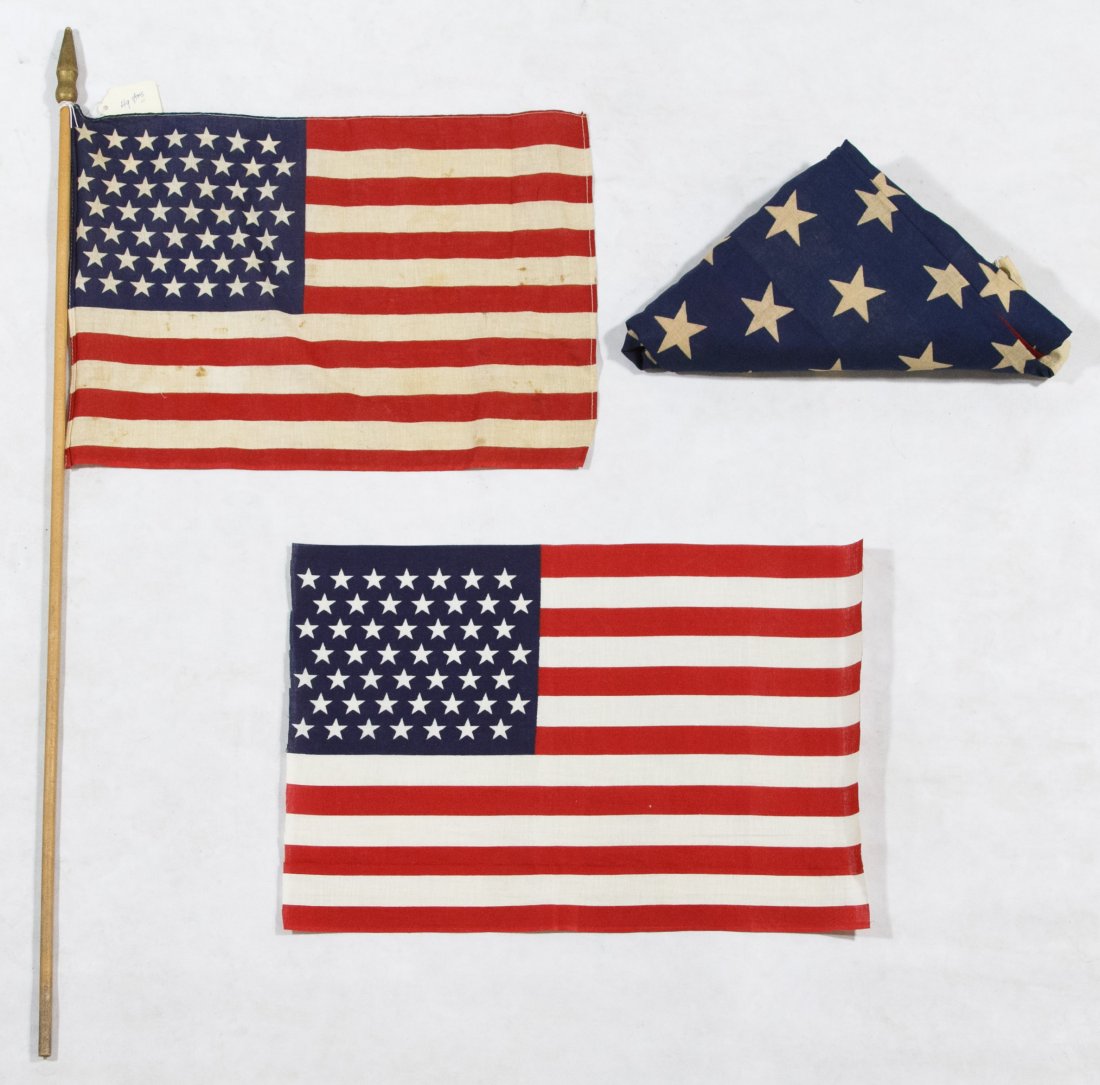 49-Star American Flag Assortment: 49-Star American Flag Assortment c.1959 three cotton printed flags; one on a pole, another folded into a triangle Height: 36.00 inches, Width: 60.00 inches (triangle folded flag) Category: Collectible
