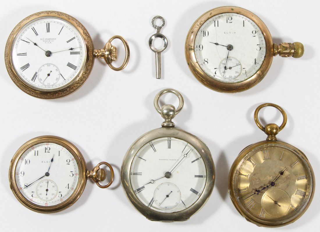 Open Face Pocket Watch Assortment: Open Face Pocket Watch Assortment Five pocket watches including Elgin, N Y Standard, National 'H H Taylor' serial #39093 and unmarked having an engraved face, some having gold filled cases; two key wi
