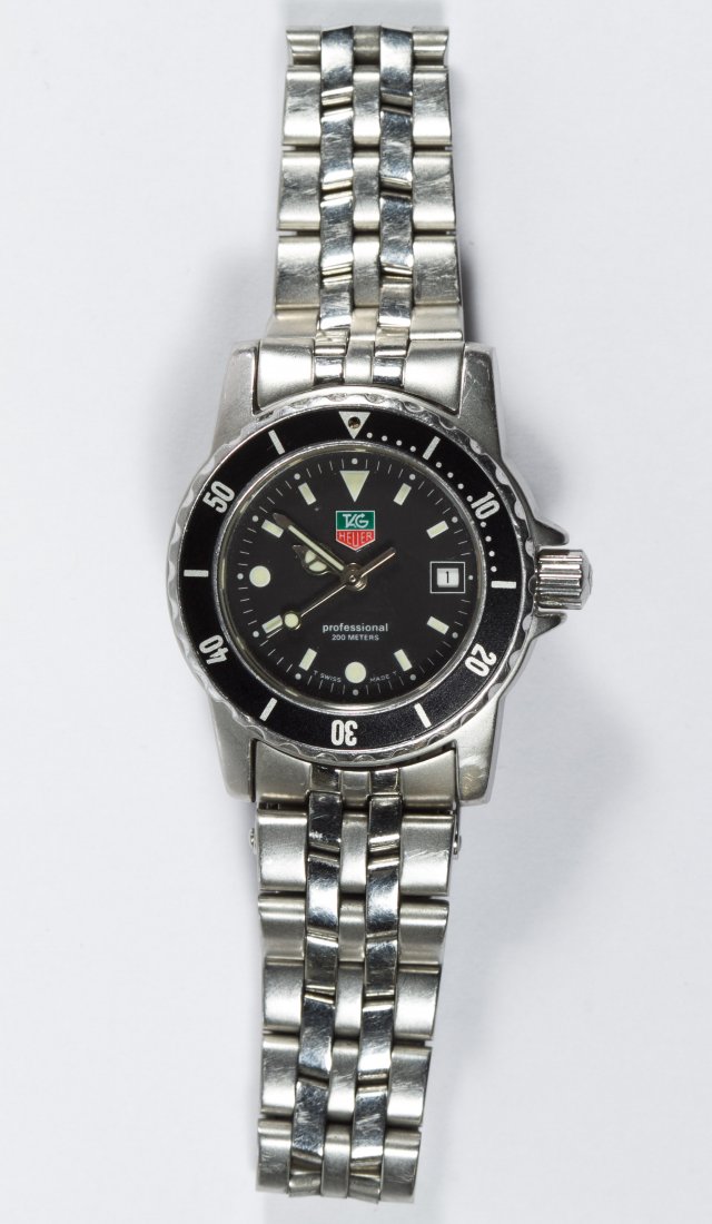 Tag Heuer Professional 200m WD1410-D0 Wrist Watch: Tag Heuer Professional 200m WD1410-D0 Wrist Watch Serial #RU4979 having a black face Length: 7.25 inches Category: Jewelry & Timepieces > Watches Shipping Status: Leonard Auction, Inc. will directly s