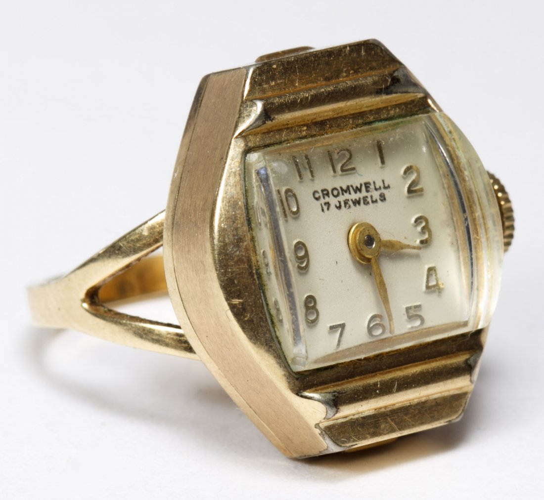 Cromwell 10k Gold Watch Ring: Cromwell 10k Gold Watch Ring Having a rolled gold plate watch case on a 10k gold band; together with a Citizen ladies wrist watch having 10k Black Hills gold shoulder band; all marked 10k Length: 3.00