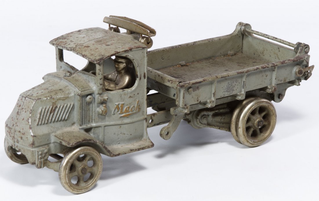 Arcade Cast Iron Mack Truck: Arcade Cast Iron Mack Truck Having a driver and the embossed Arcade mark on the underside of the cab Height: 5.75 inches, Length: 12.00 inches, Width: 4.50 inches Category: Toys and Dolls > Antique To