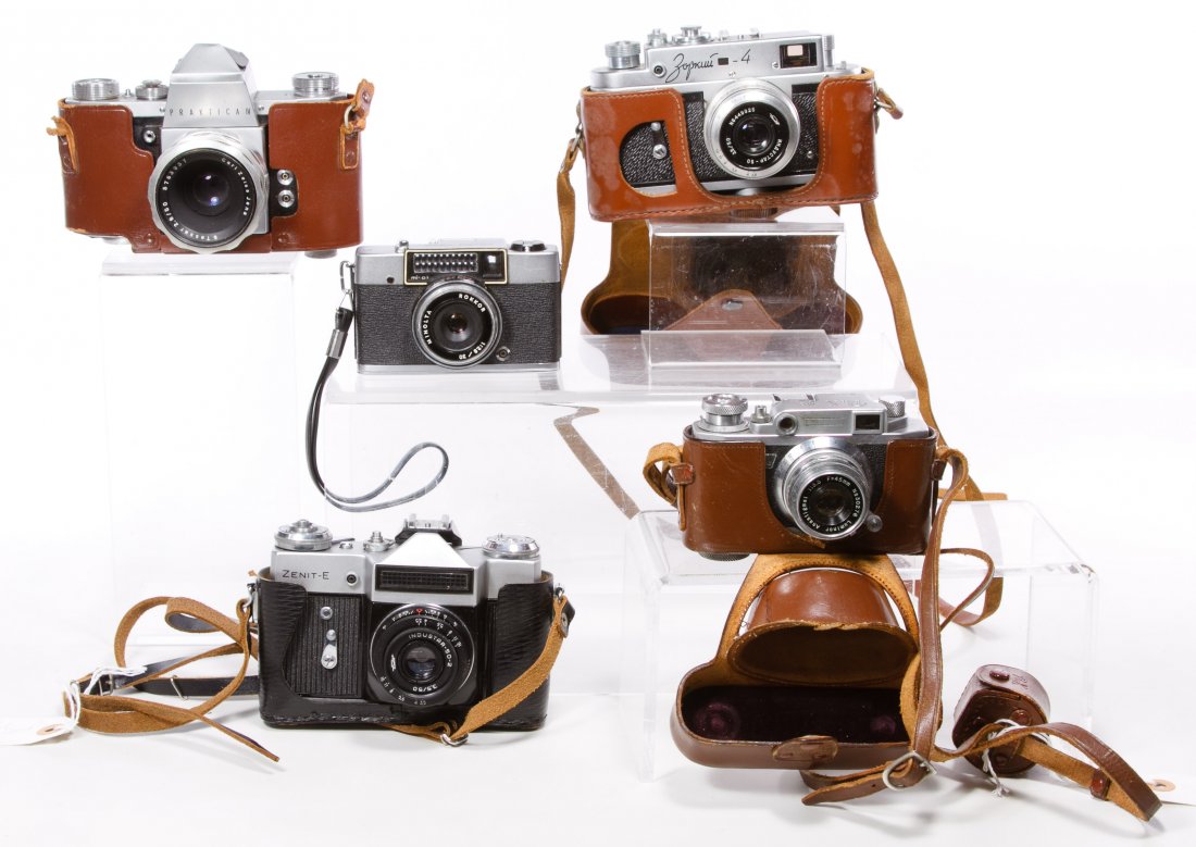 35mm Camera Assortment: 35mm Camera Assortment Five cameras including examples from Pratica IV with a Carl Zeiss lens, Pax, Minolta, Zenit-E and Zopkuu; all have leather cases Width: 6.00 inches (widest camera) Category: Cam