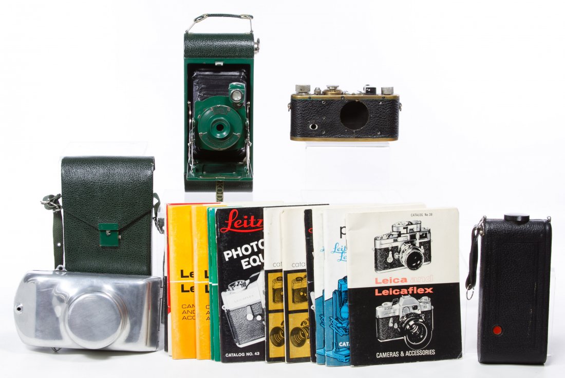 Leica D.R.P. 35mm Camera: Leica D.R.P. 35mm Camera Serial #24385; together with folding camera flask, Kodak folding camera, hard shell case and instruction booklets Width: 5.50 inches (leica) Category: Cameras & Electronics >