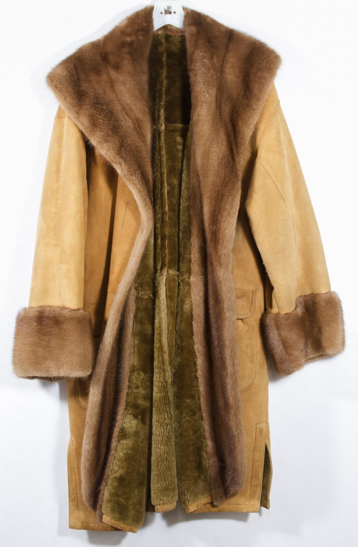 Shearling and Mink Coat: Shearling and Mink Coat Having a mink collar and cuffs on a shearling body; label 'Kirkis for FantaZia New York' on the inside of right pocket Length: 42.00 inches, Width: 29.00 inches Size: large Cat