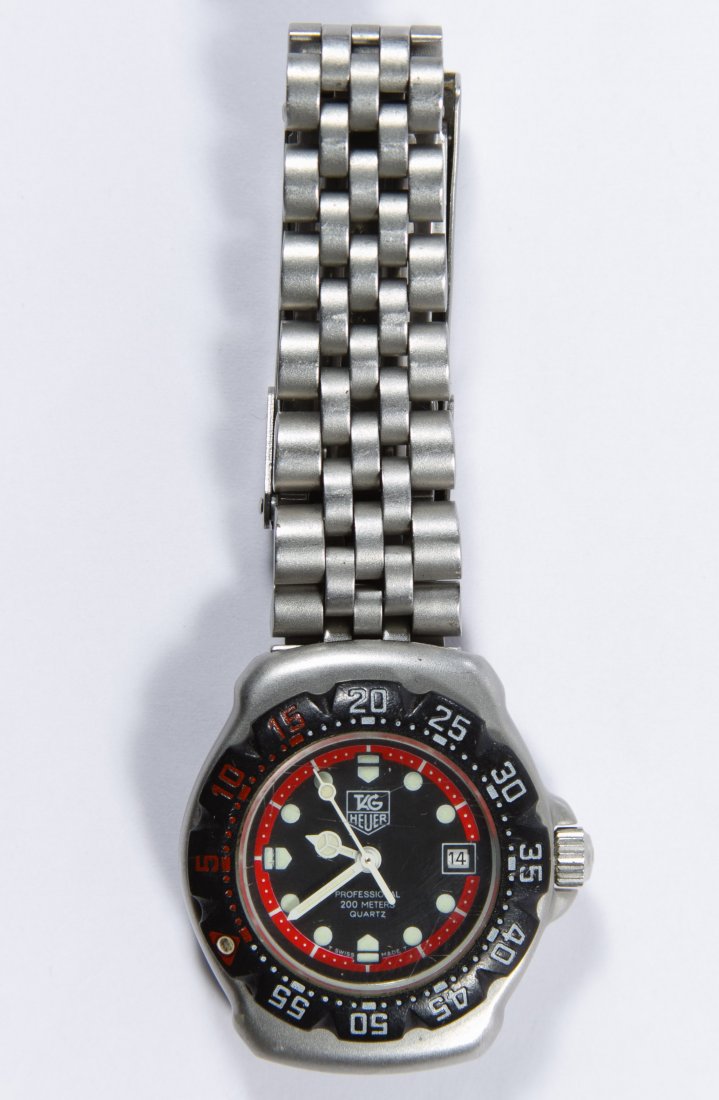 Tag Heuer 'Professional 200m' 3.90 Quartz Wrist Watch: Tag Heuer 'Professional 200m' 3.90 Quartz Wrist Watch Serial #956114 having a black face and a seven jewel V8 Swiss movement Length: 6.00 inches (adjustable) Category: Jewelry & Timepieces > Watches S