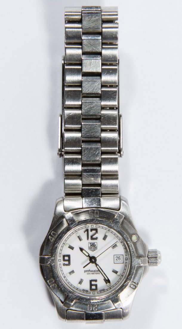 Tag Heuer 'Professional 200m' 2.98 Quartz Wrist Watch: Tag Heuer 'Professional 200m' 2.98 Quartz Wrist Watch Serial #956112 having a white face and a seven jewel Swiss movement Length: 6.50 inches (adjustable) Category: Jewelry & Timepieces > Watches Ship
