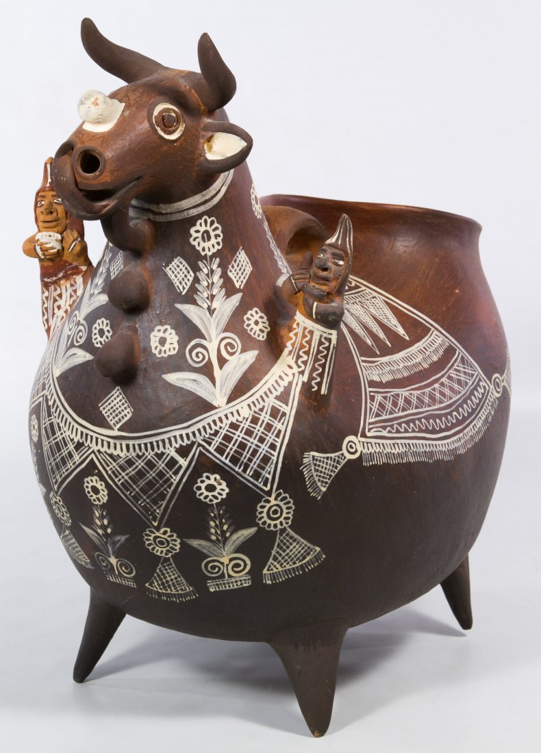 South American Pottery Goat: South American Pottery Goat Terra cotta animal shaped vessel with a human figure on each shoulder, a handle on the back, painted decoration, an open mouth at front and open back Height: 16.00 inches, 