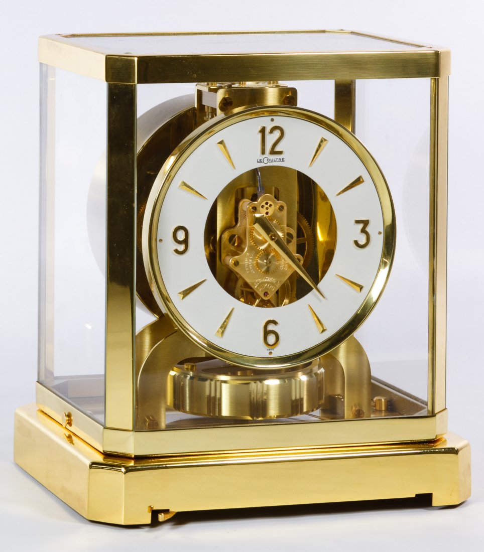 Le Coultre & Cie Atmos Perpetual Mantel Clock: Le Coultre & Cie Atmos Perpetual Mantel Clock Having fifteen jewels, model #5090, serial #187926, brass and glass enclosure and the instructional leaflet Height: 9.50 inches, Width: 8.50 inches Catego